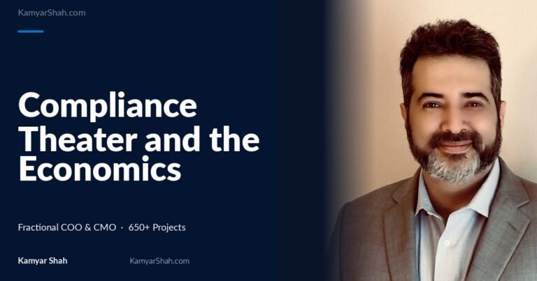 Hero banner: article title 'Compliance Theater and the Economics of Delay' on a dark blue panel beside a man in a gray suit smiling on the right.